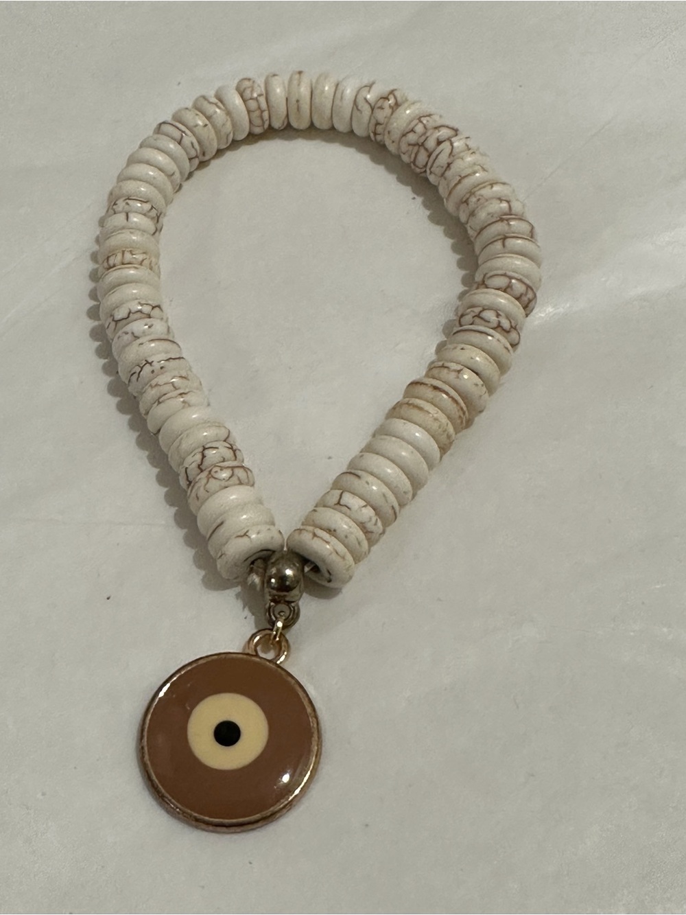 Neutral Beaded Bracelet with Brown Eye Charm